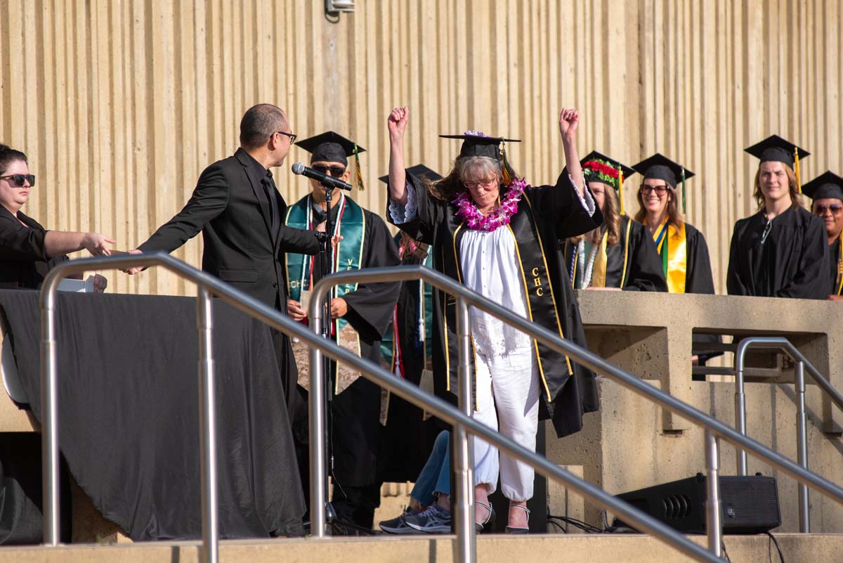 Graduates walk across stage at CHC Commencement 2024.