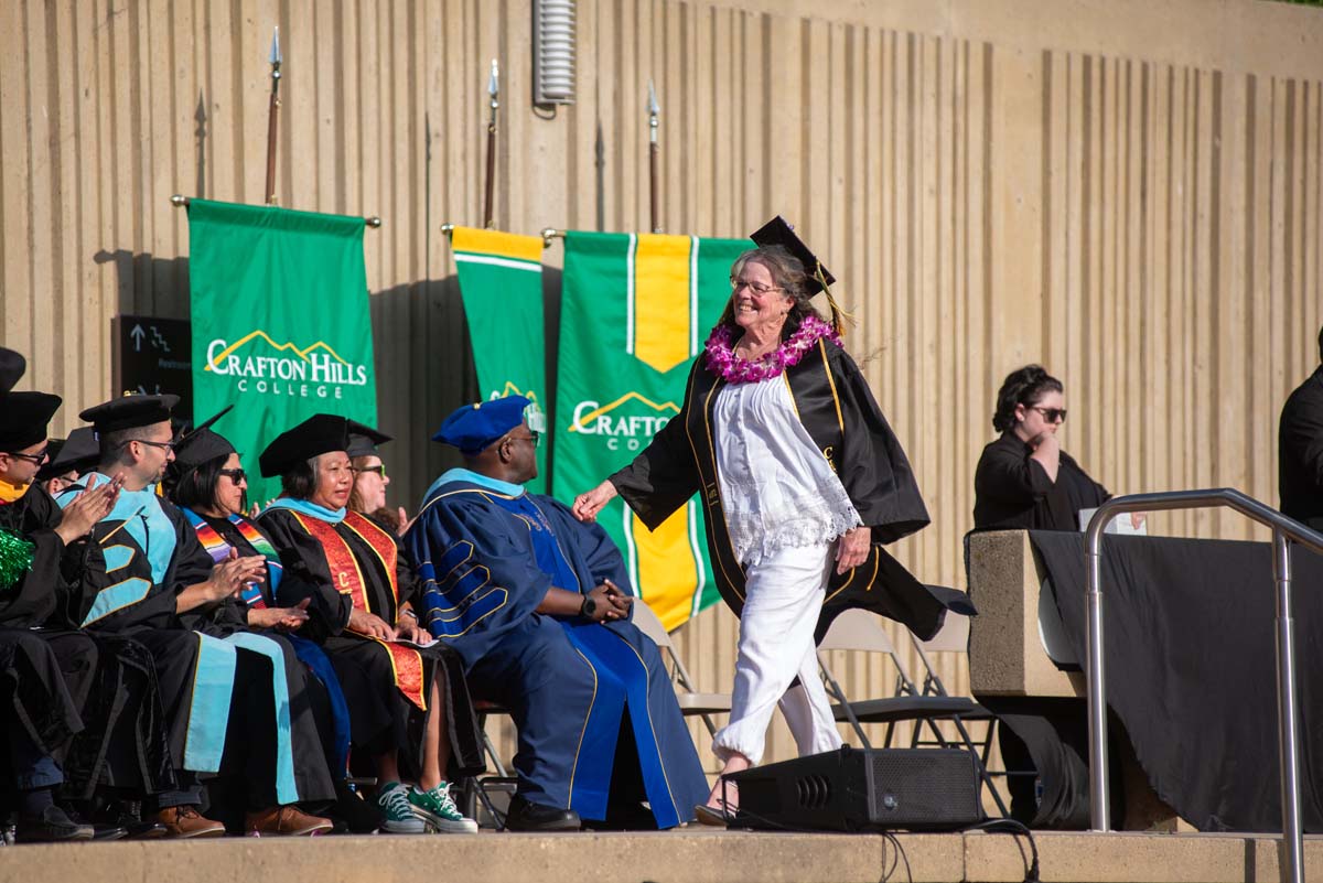 Graduates walk across stage at CHC Commencement 2024.