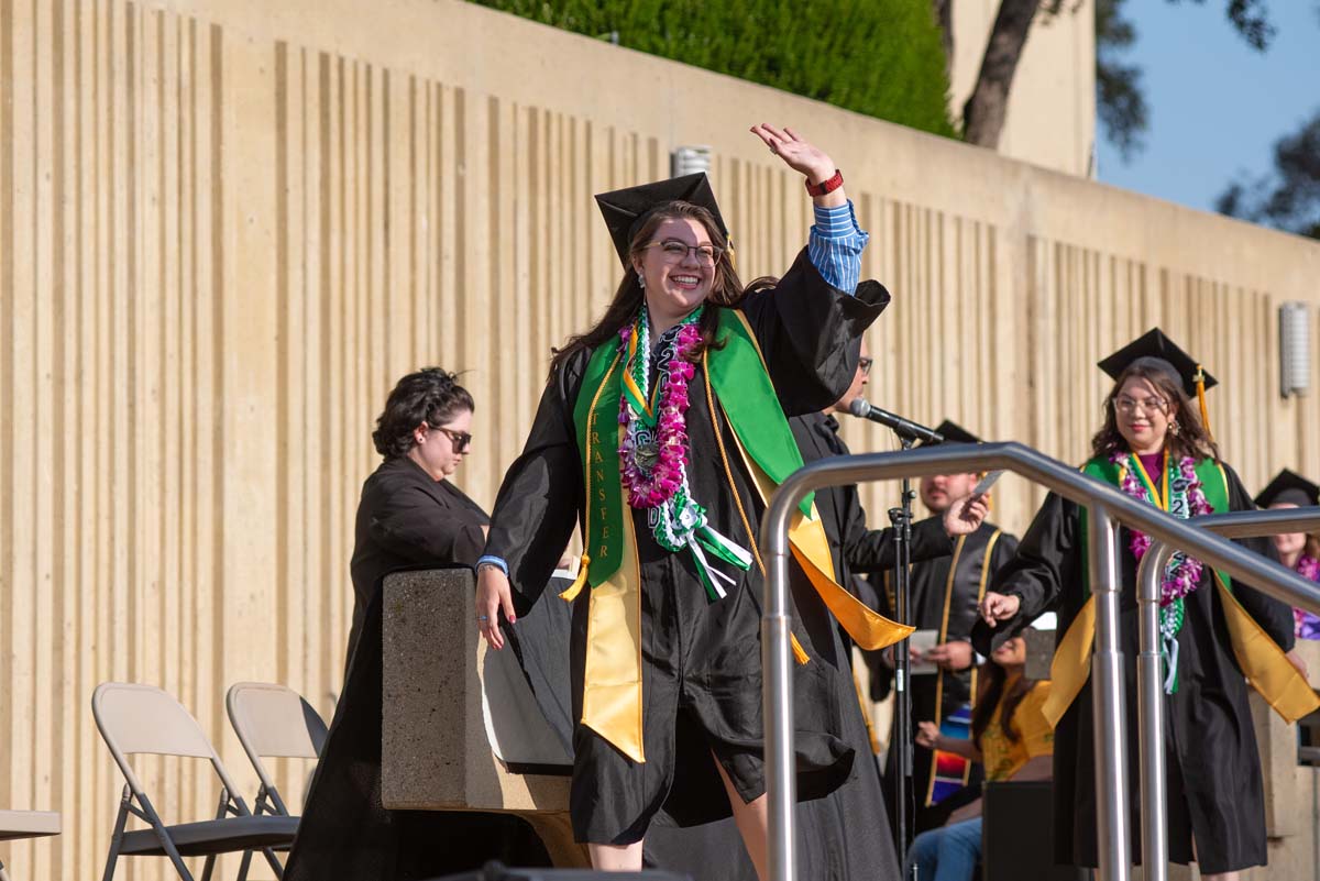 Graduates walk across stage at CHC Commencement 2024.