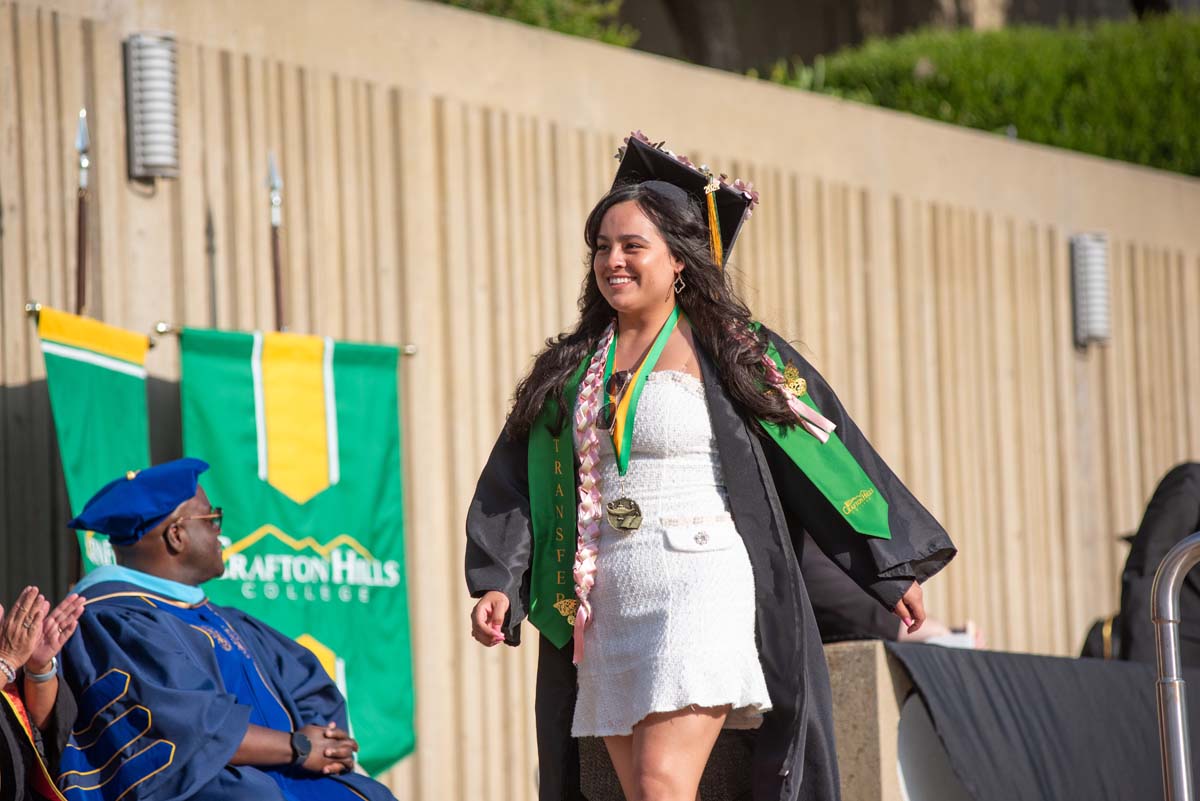 Graduates walk across stage at CHC Commencement 2024.