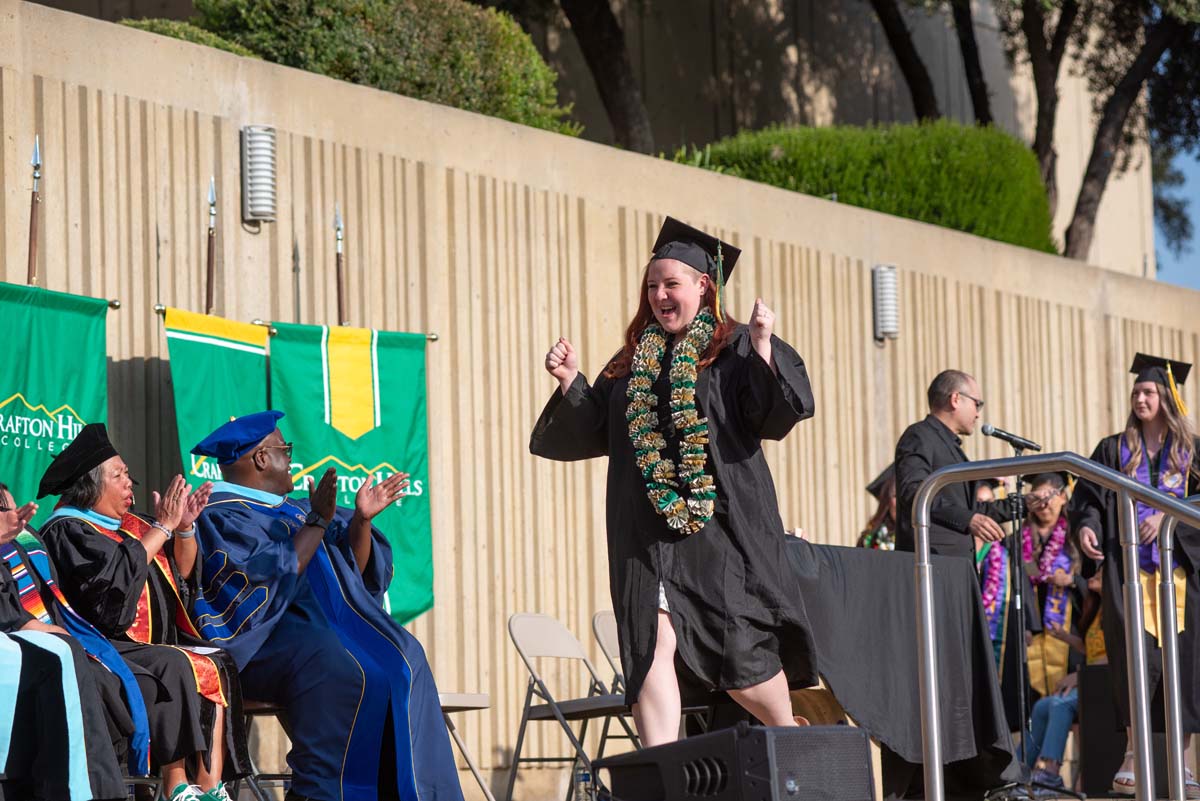 Graduates walk across stage at CHC Commencement 2024.