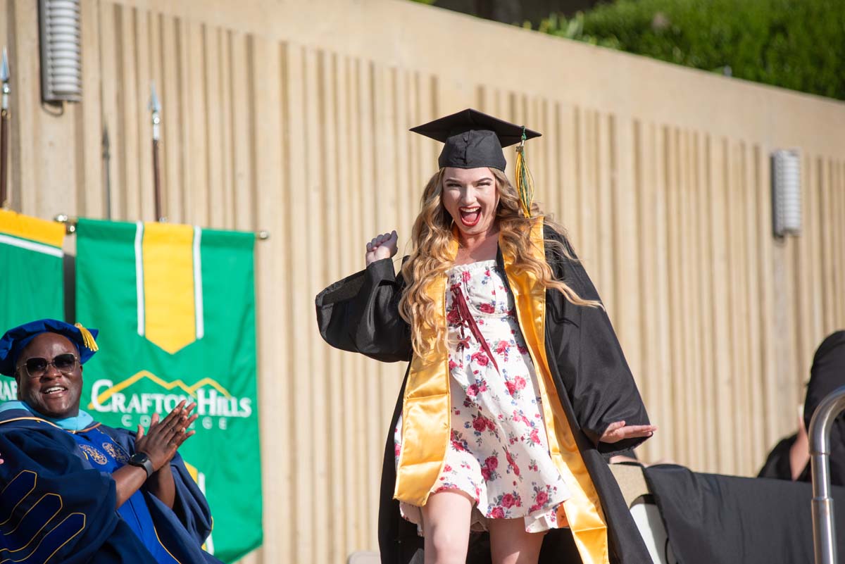 Graduates walk across stage at CHC Commencement 2024.