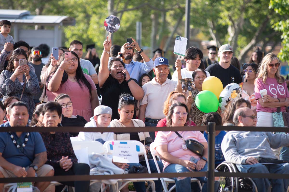 Graduates walk across stage at CHC Commencement 2024.