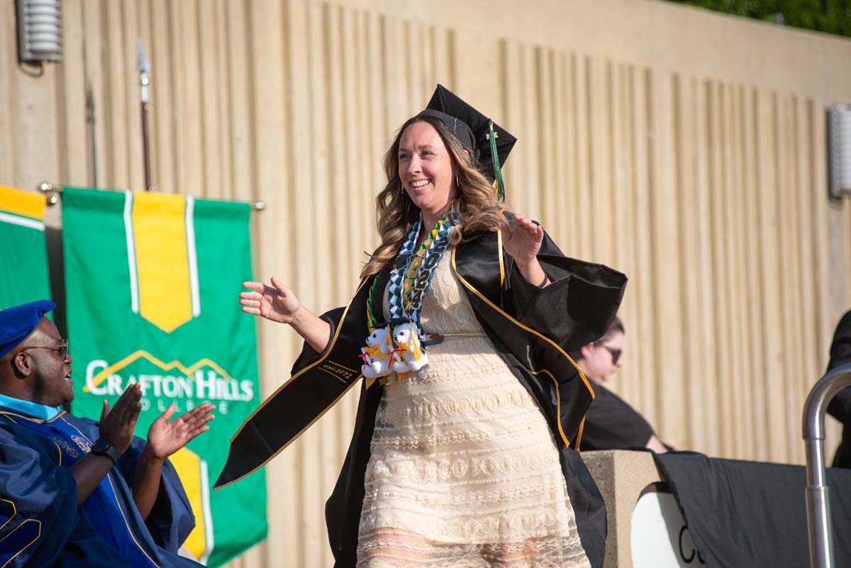 Graduates walk across stage at CHC Commencement 2024.