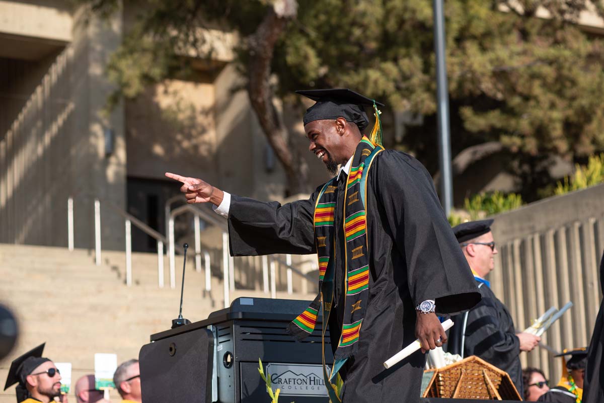 Graduates walk across stage at CHC Commencement 2024.