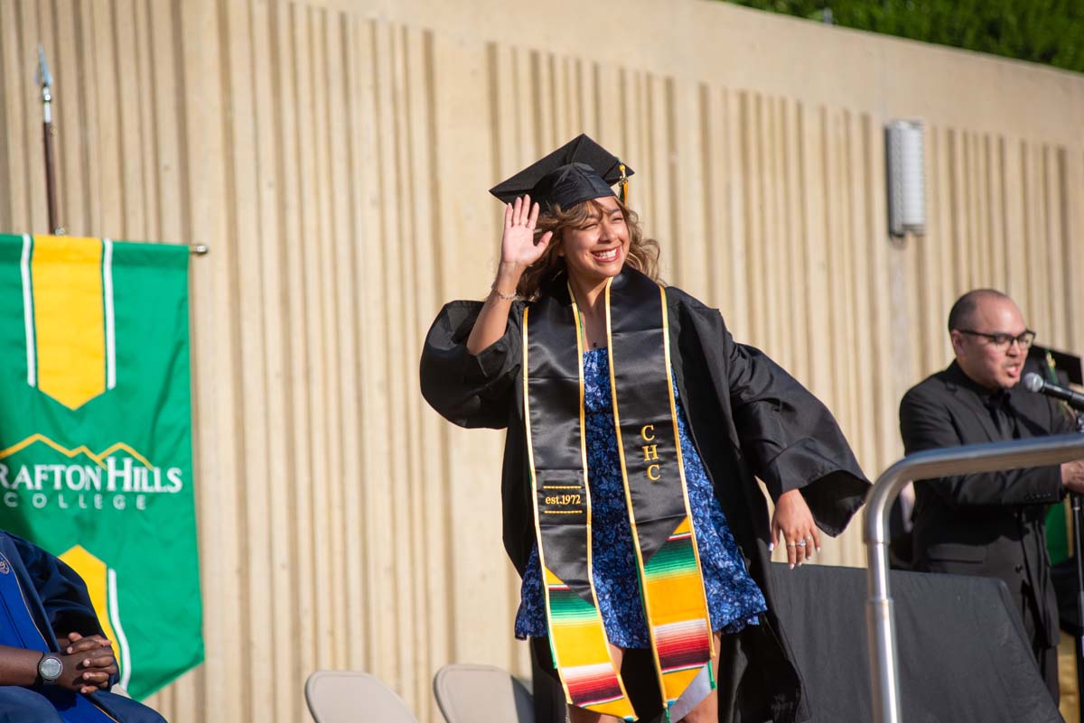 Graduates walk across stage at CHC Commencement 2024.