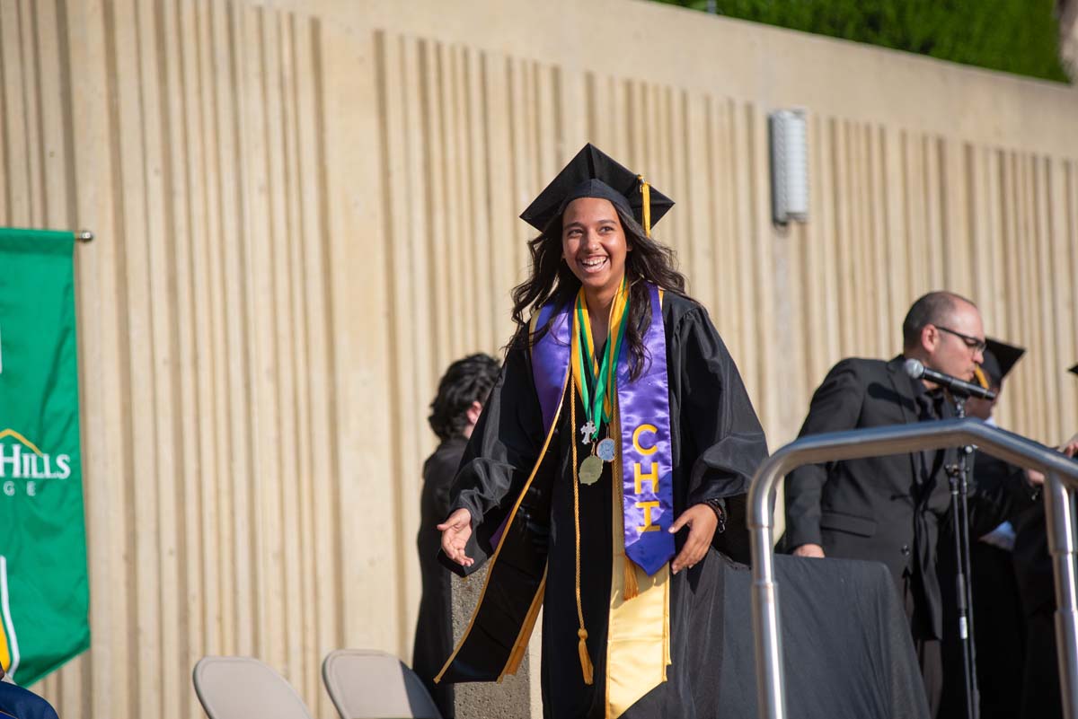 Graduates walk across stage at CHC Commencement 2024.