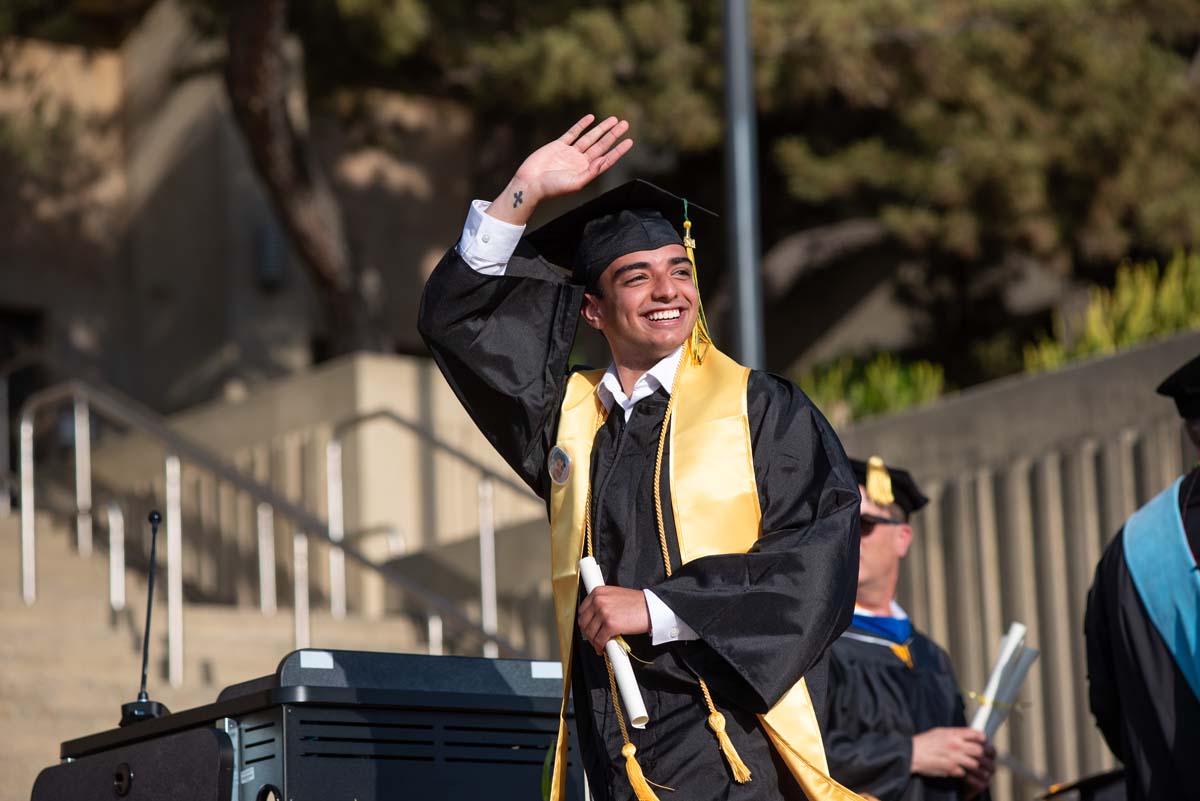 Graduates walk across stage at CHC Commencement 2024.