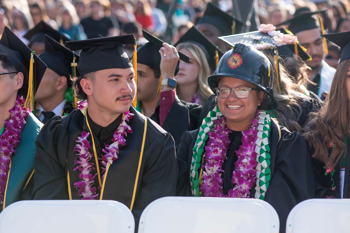Graduates walk across stage at CHC Commencement 2024.