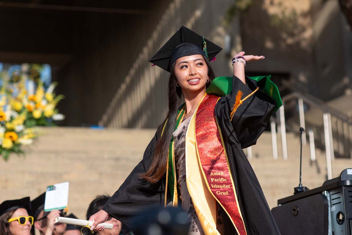 Graduates walk across stage at CHC Commencement 2024.