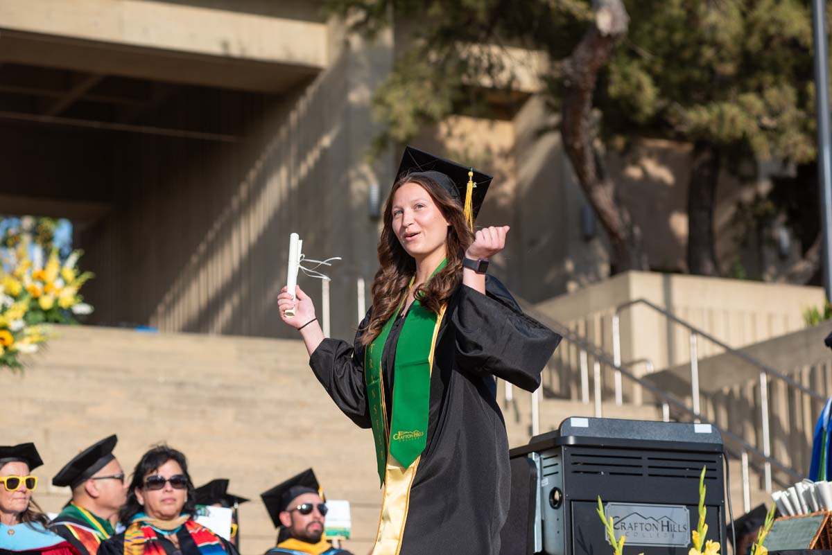 Graduates walk across stage at CHC Commencement 2024.