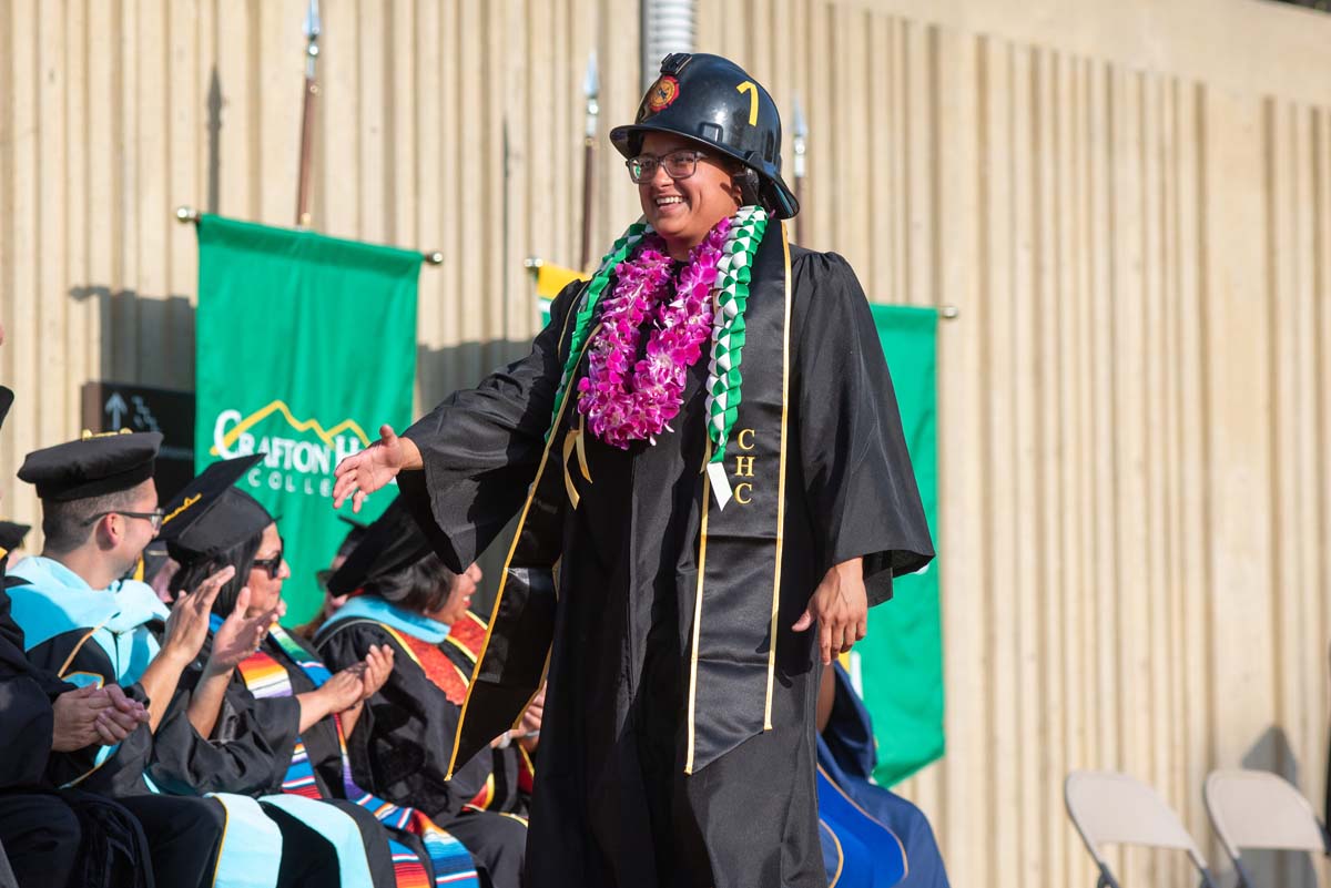 Graduates walk across stage at CHC Commencement 2024.