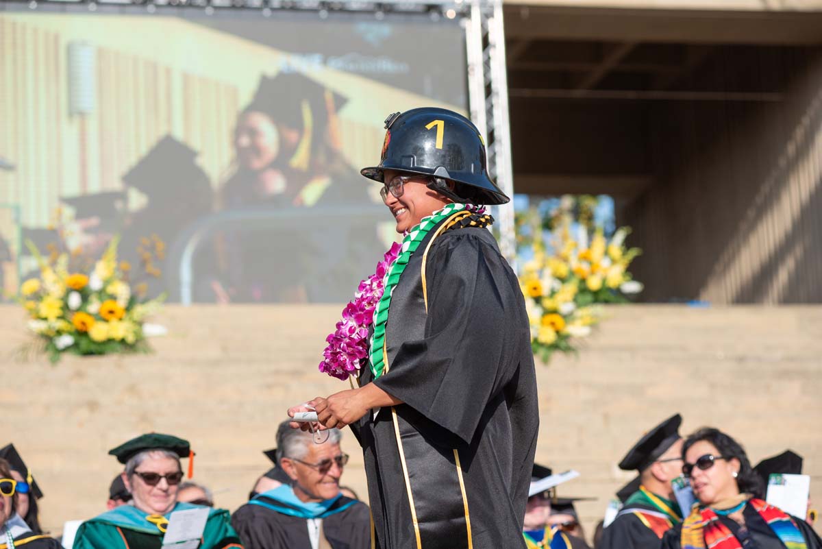 Graduates walk across stage at CHC Commencement 2024.