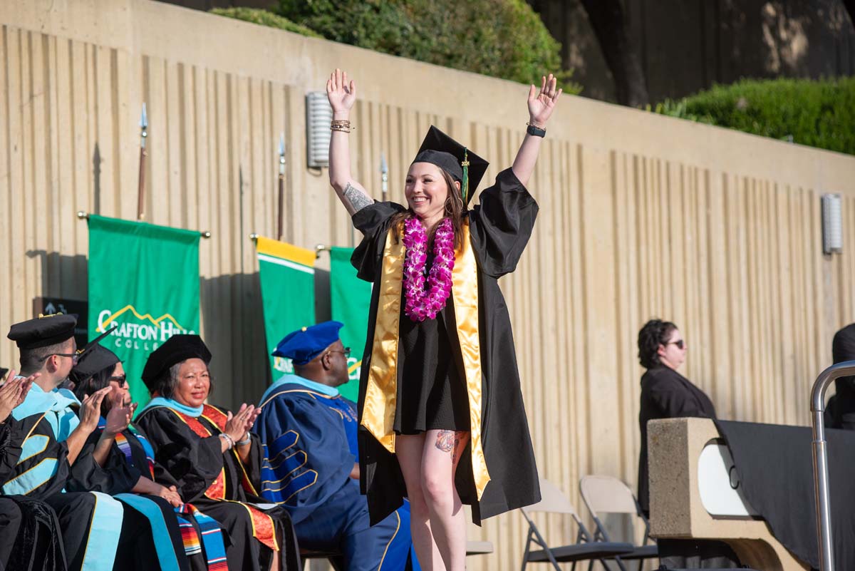 Graduates walk across stage at CHC Commencement 2024.