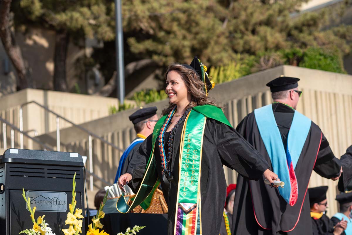 Graduates walk across stage at CHC Commencement 2024.