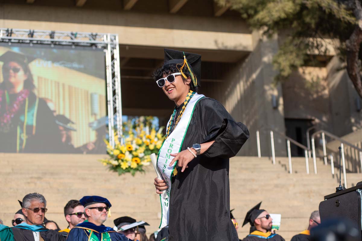 Graduates walk across stage at CHC Commencement 2024.