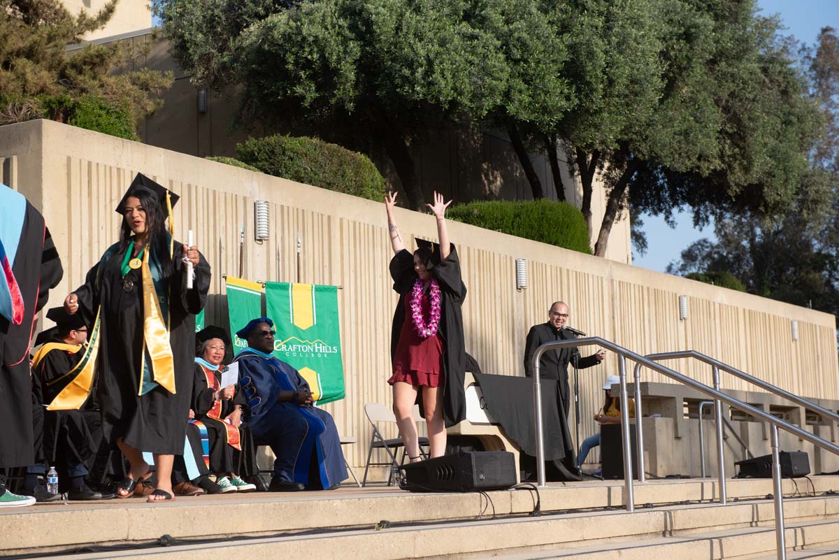 Graduates walk across stage at CHC Commencement 2024.