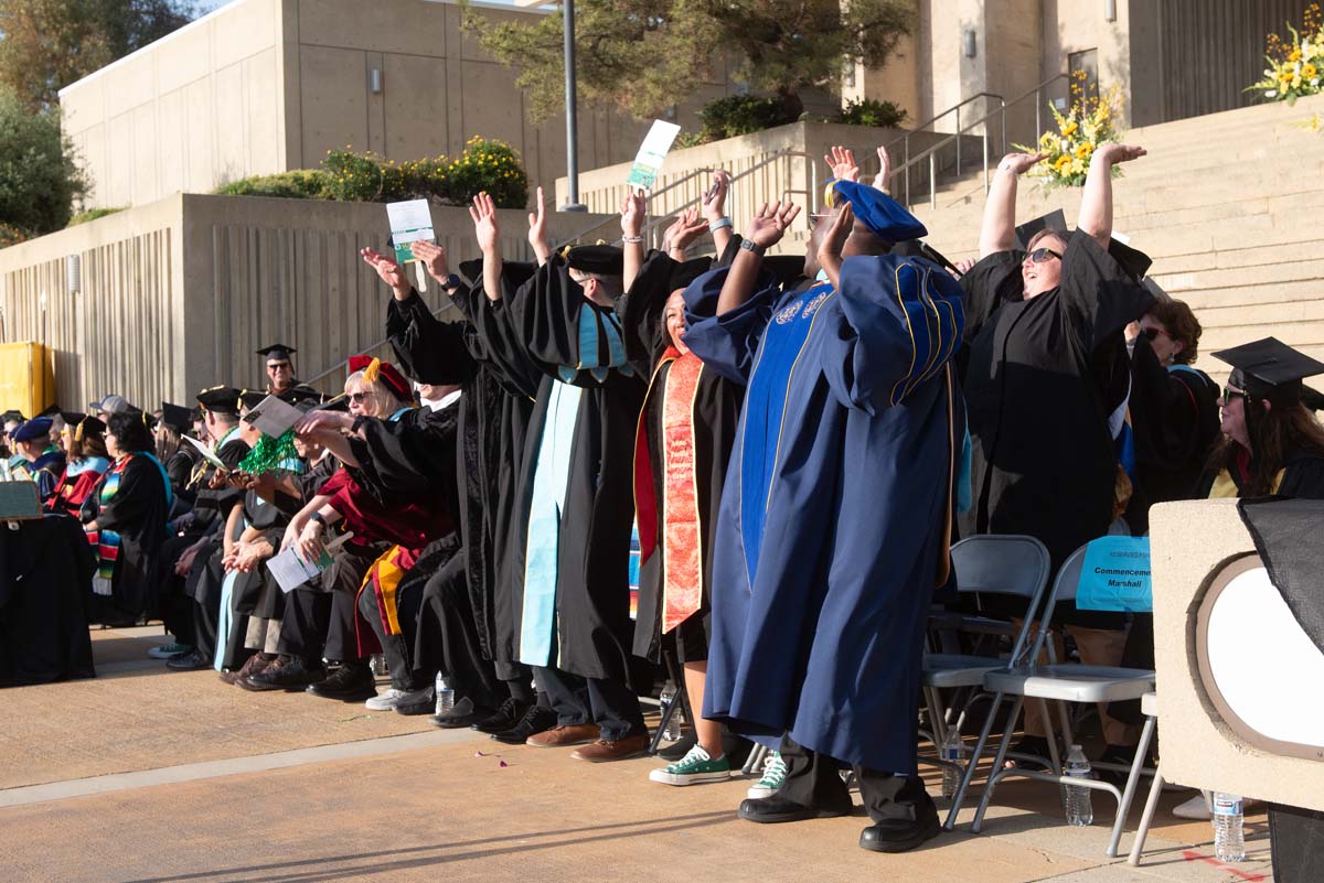 Graduates walk across stage at CHC Commencement 2024.