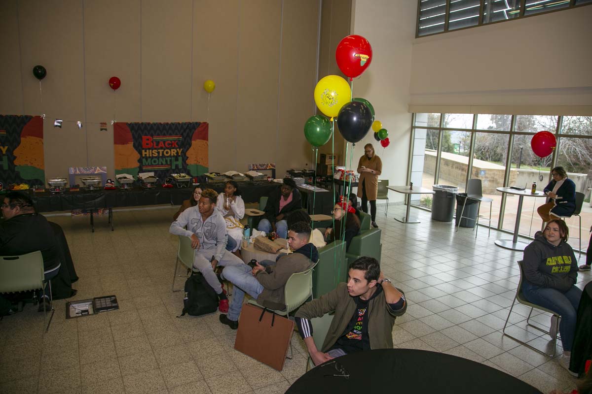 People enjoying the Black History Month closing ceremony