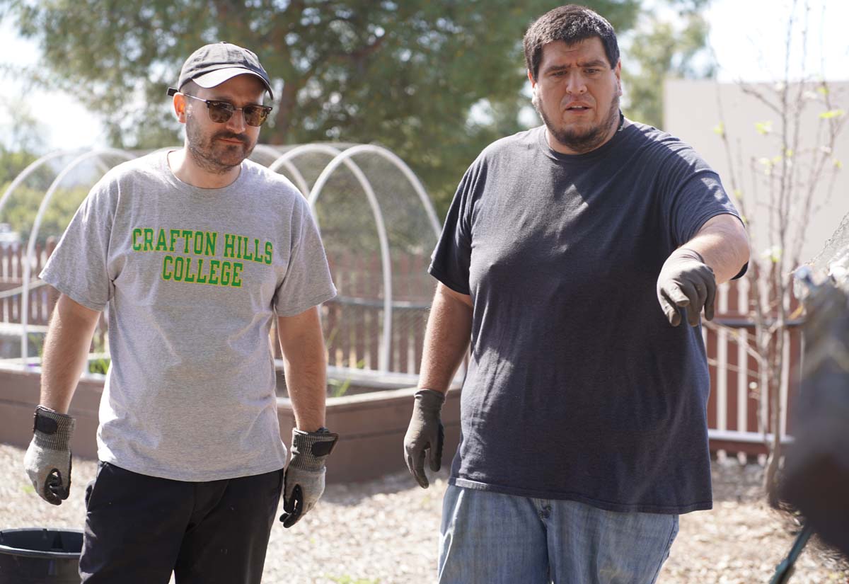 Students attend the planting party at the CHC garden.