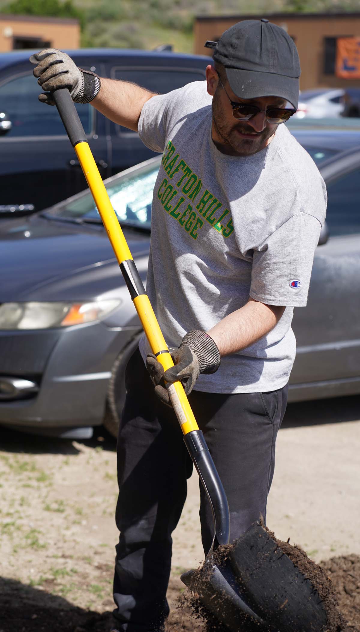 Students attend the planting party at the CHC garden.