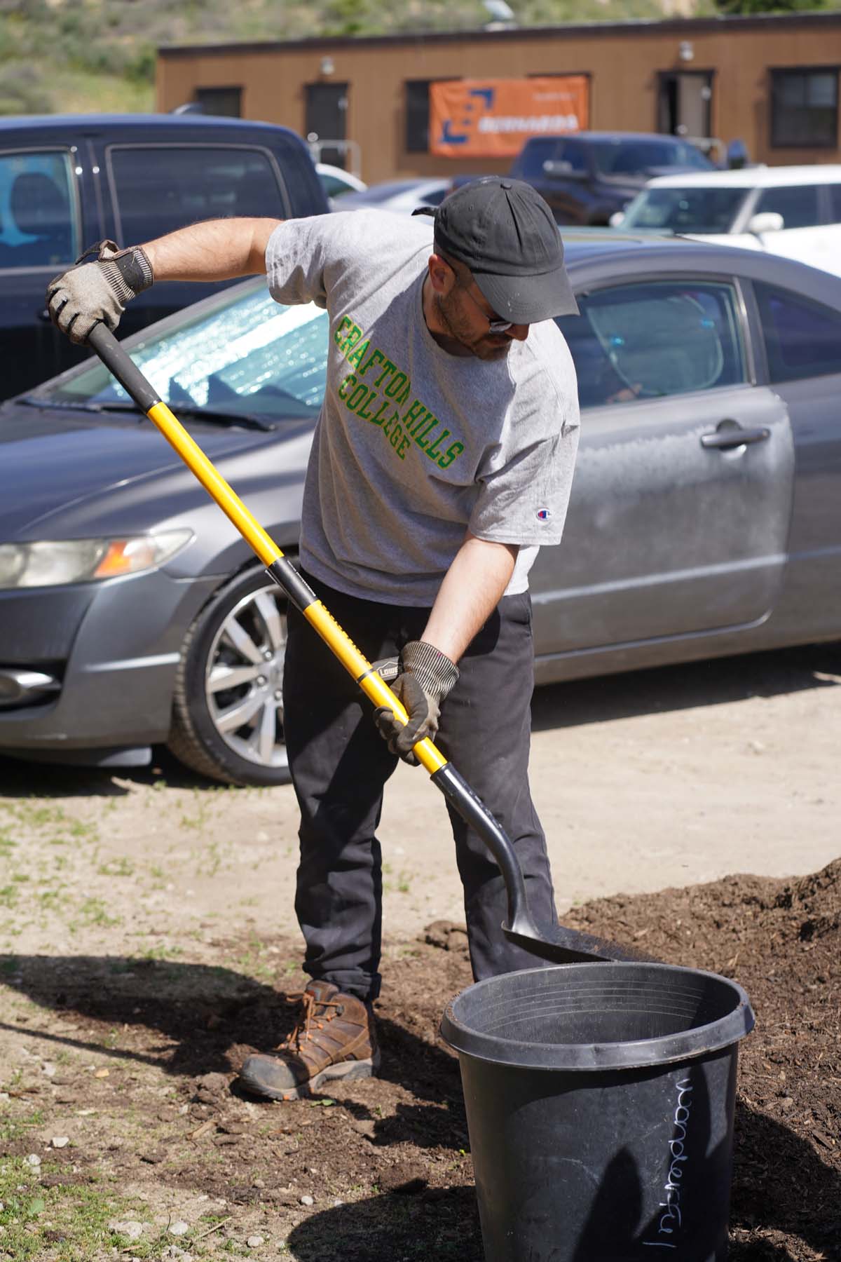 Students attend the planting party at the CHC garden.