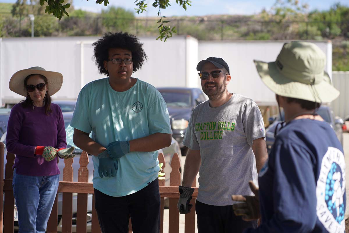 Students attend the planting party at the CHC garden.