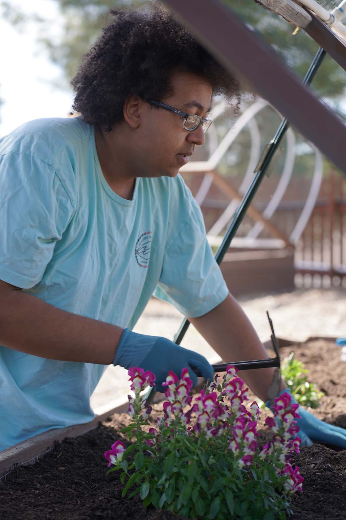 Students attend the planting party at the CHC garden.