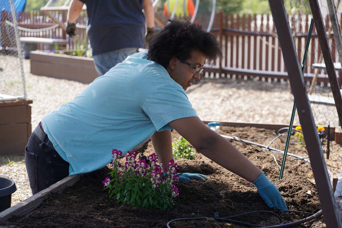 Students attend the planting party at the CHC garden.