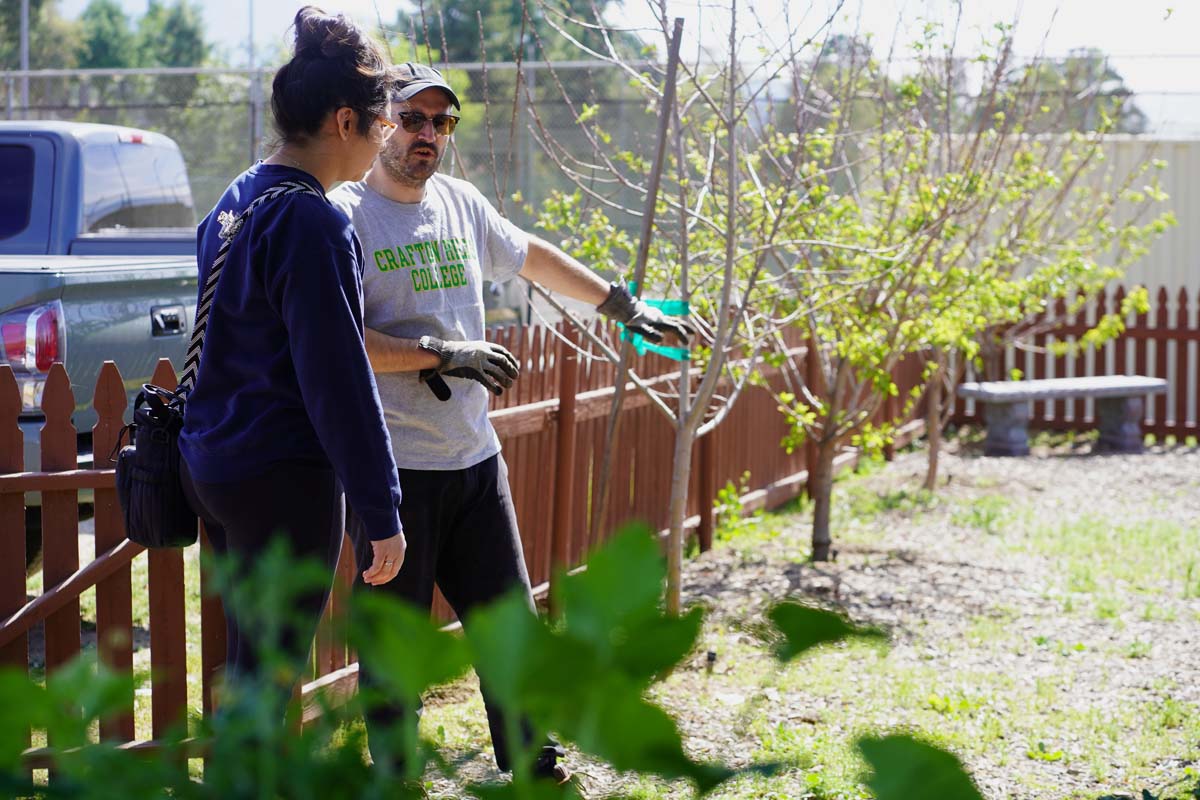 Students attend the planting party at the CHC garden.
