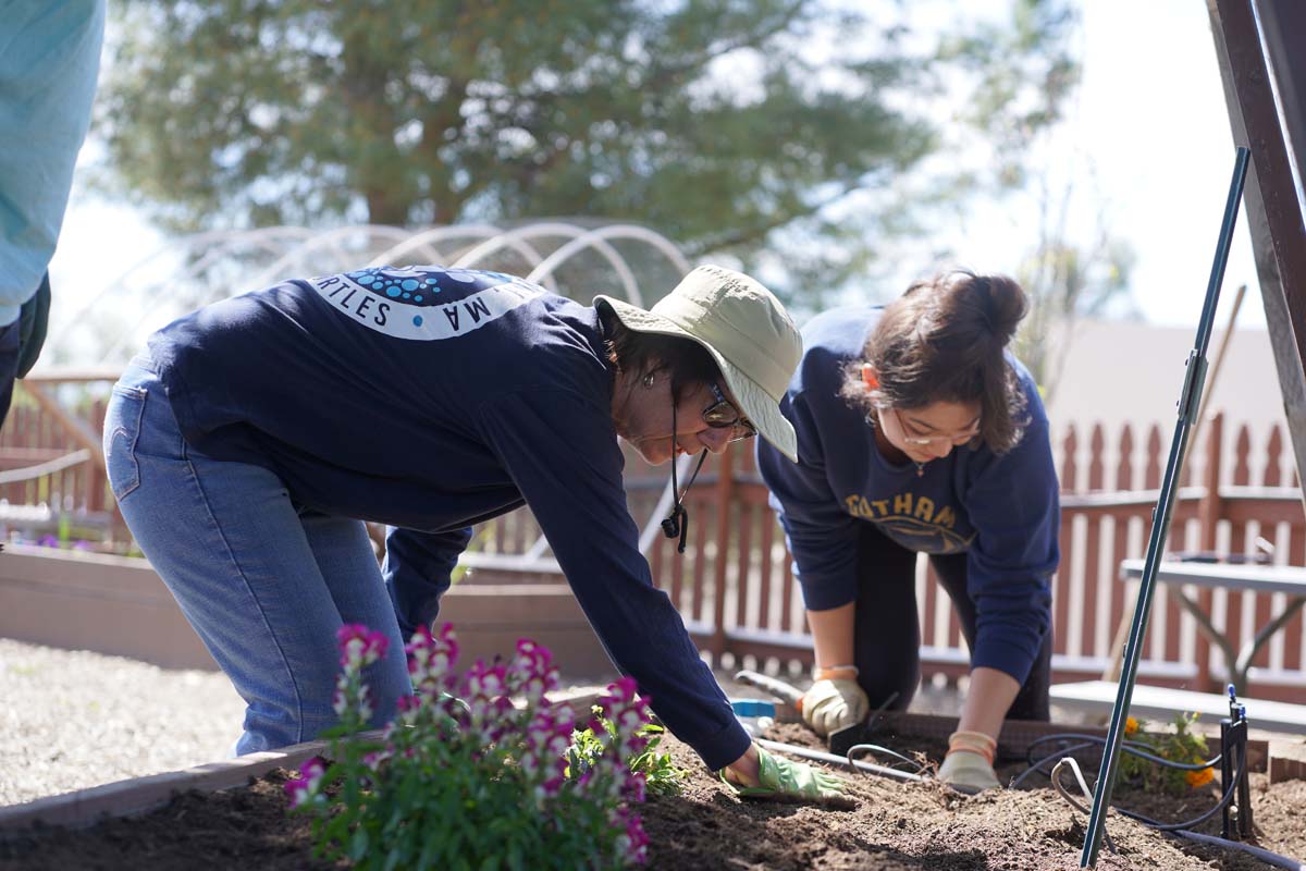 Students attend the planting party at the CHC garden.