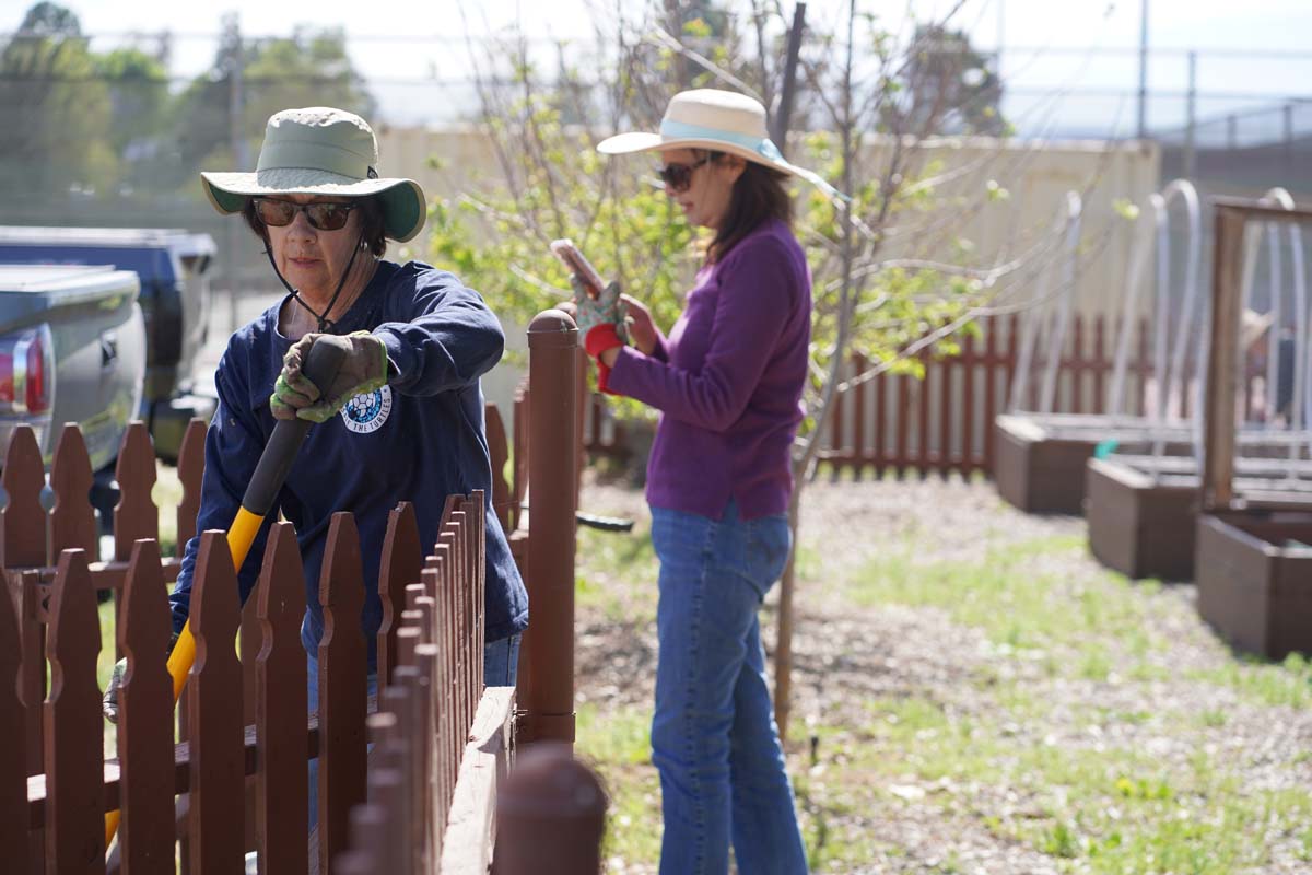 Students attend the planting party at the CHC garden.