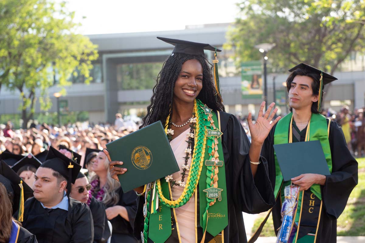 Students receive diploma covers at CHC Commencement 2025.