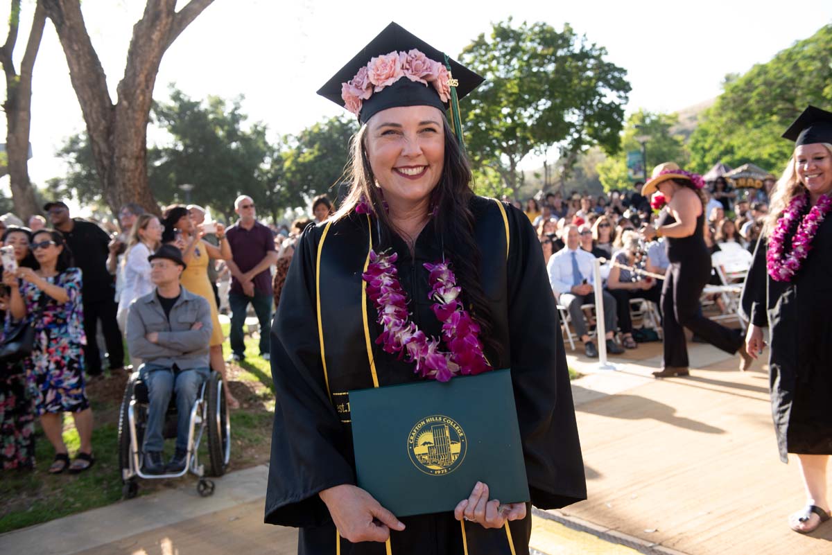 Students receive diploma covers at CHC Commencement 2025.