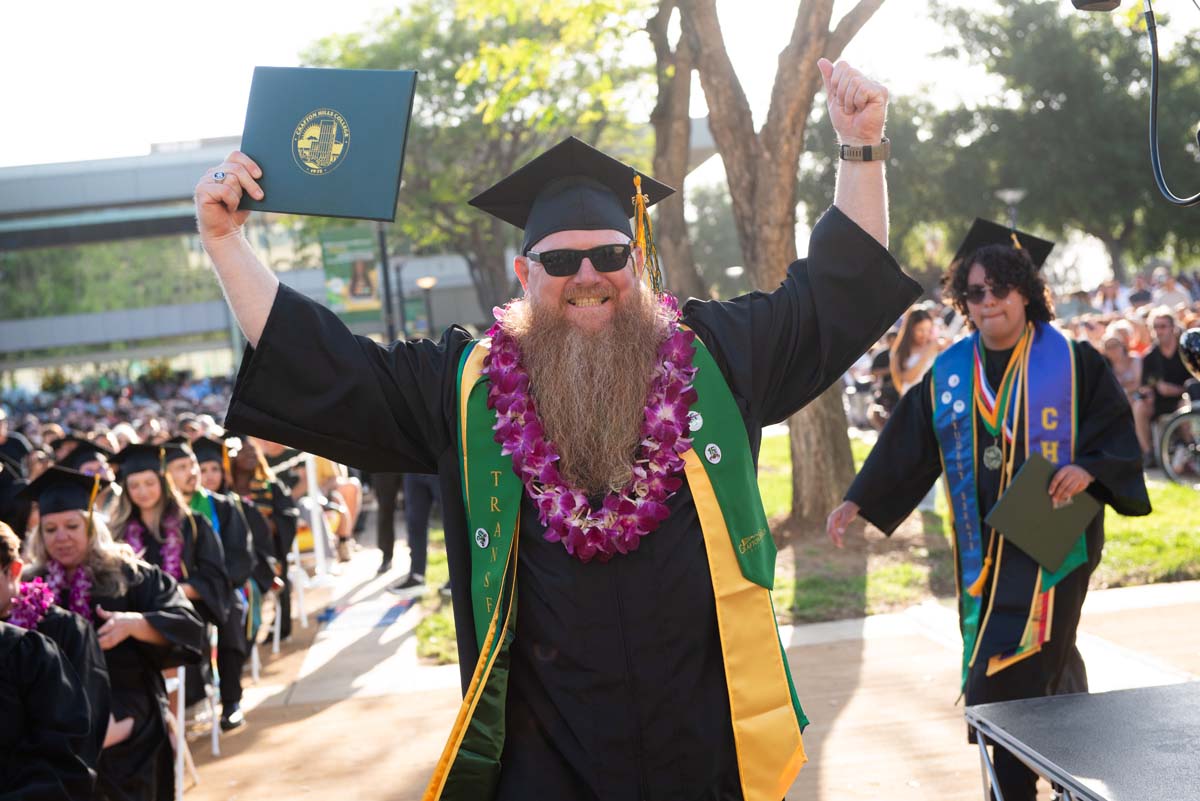 Students receive diploma covers at CHC Commencement 2025.