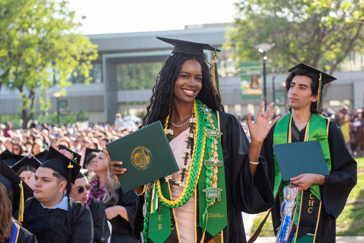 Students receive diploma covers at CHC Commencement 2025.