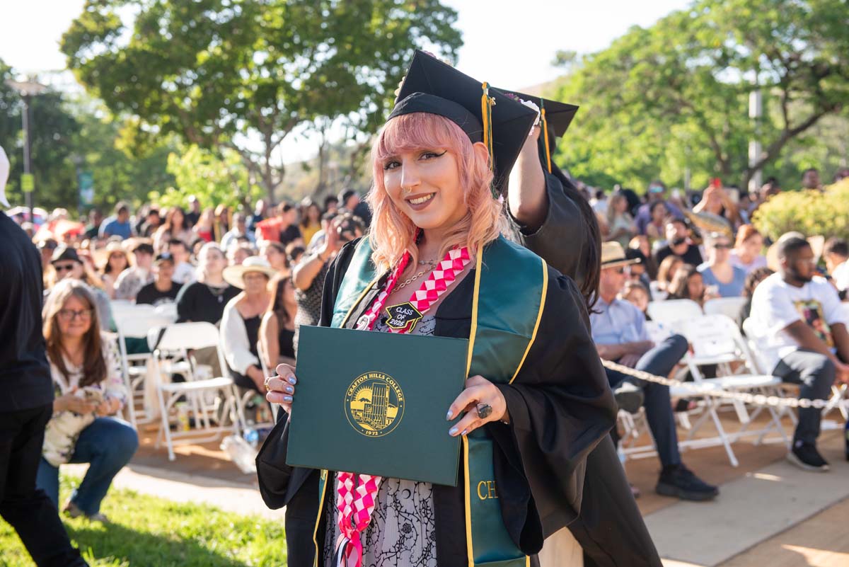 Students receive diploma covers at CHC Commencement 2025.