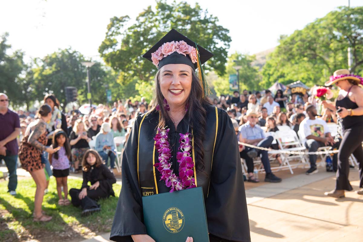 Students receive diploma covers at CHC Commencement 2025.