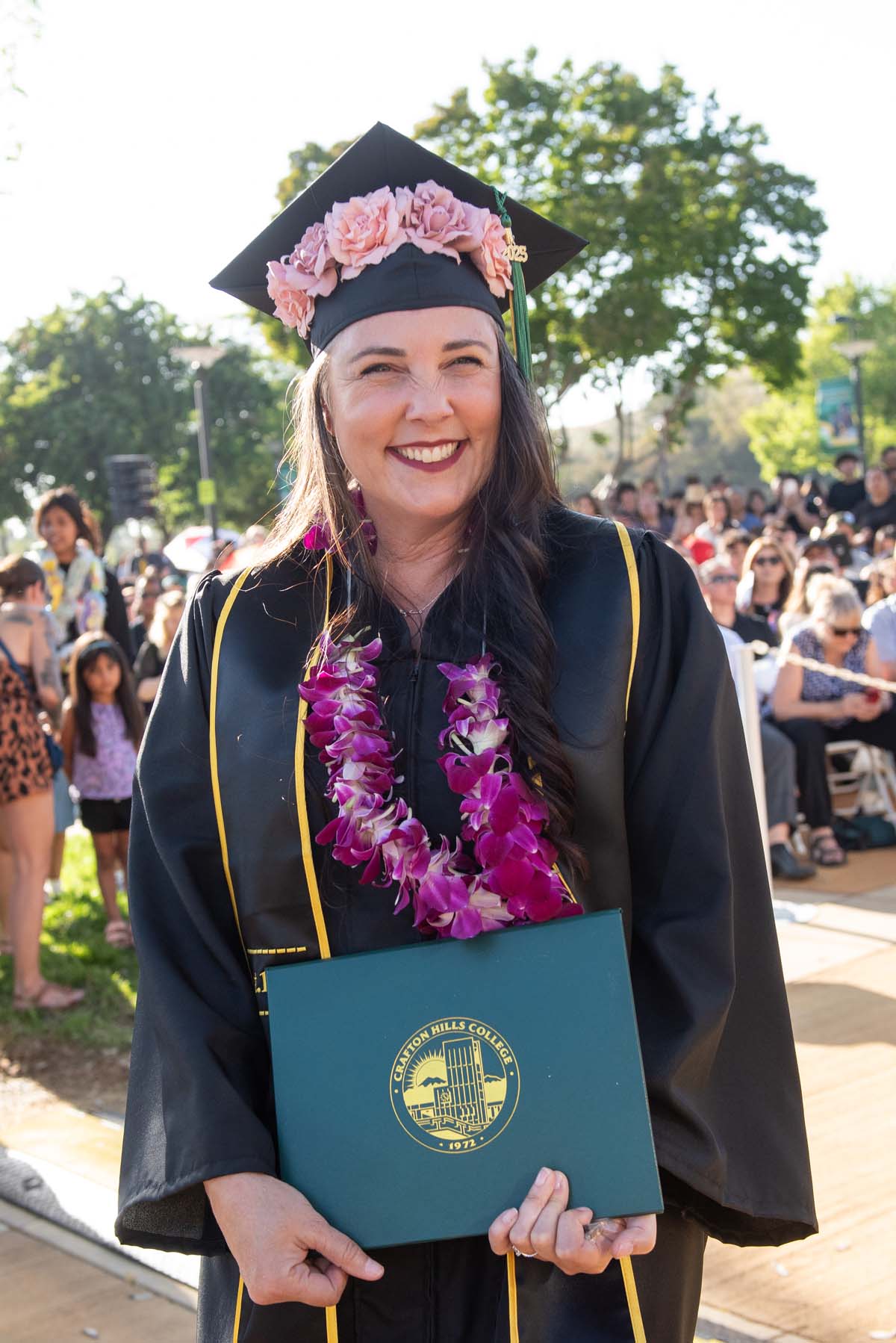 Students receive diploma covers at CHC Commencement 2025.