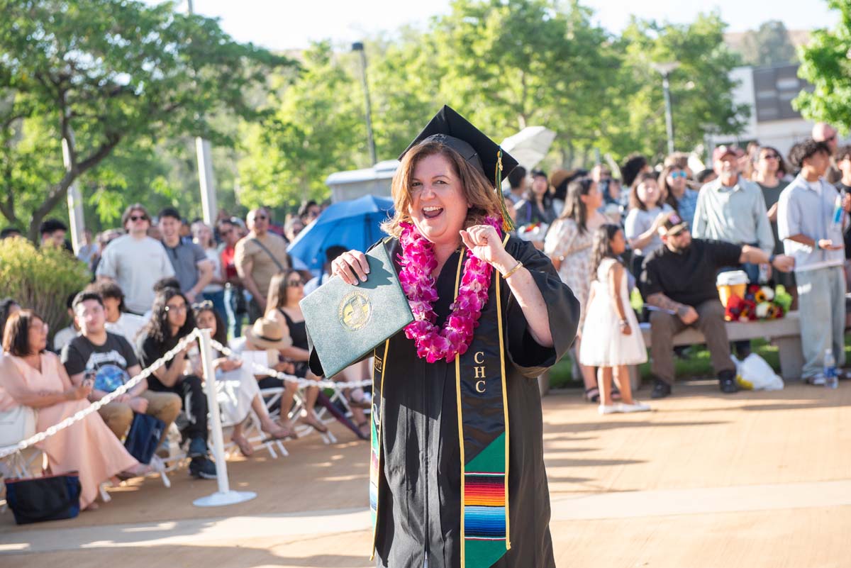Students receive diploma covers at CHC Commencement 2025.