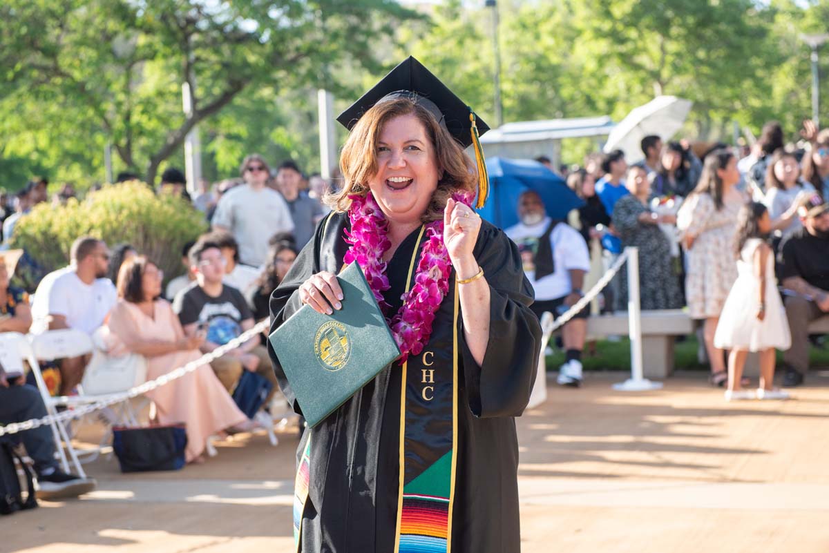 Students receive diploma covers at CHC Commencement 2025.