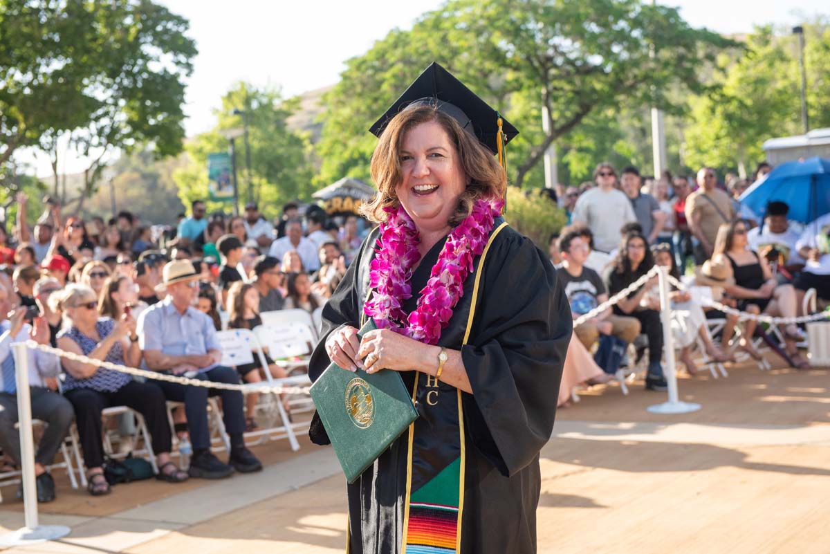 Students receive diploma covers at CHC Commencement 2025.