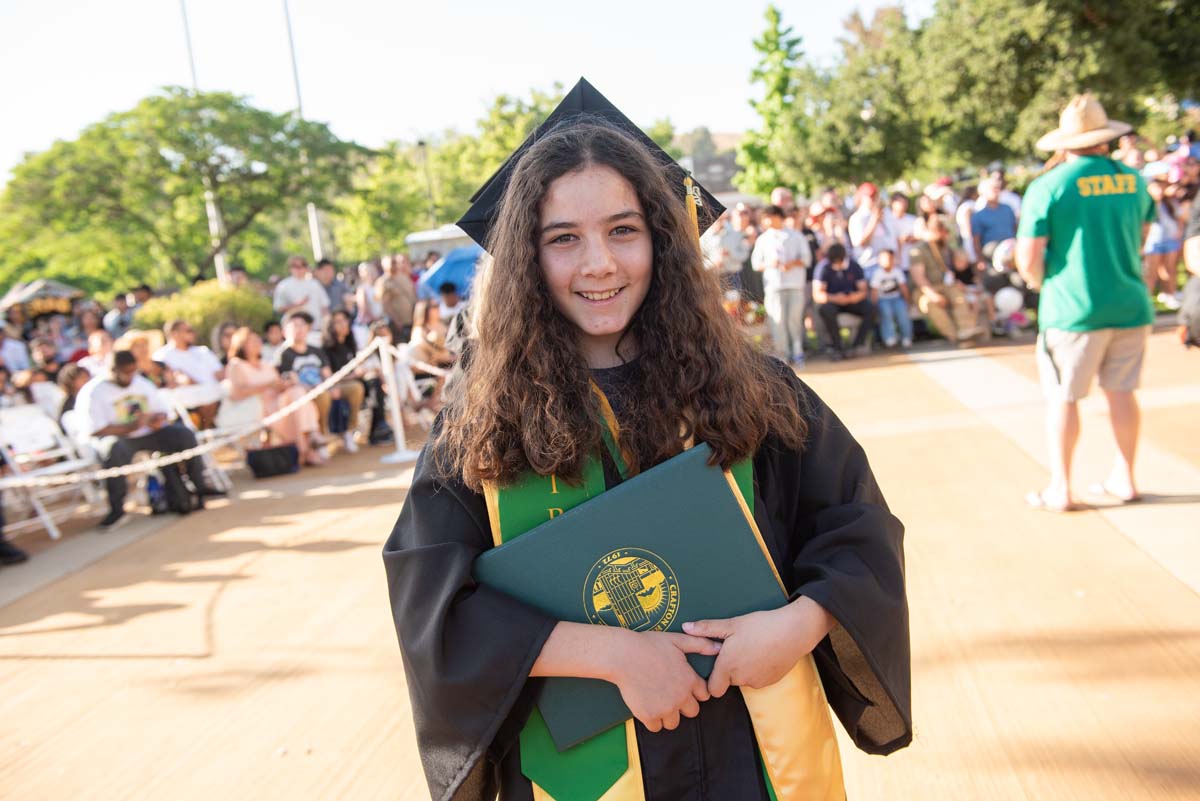 Students receive diploma covers at CHC Commencement 2025.