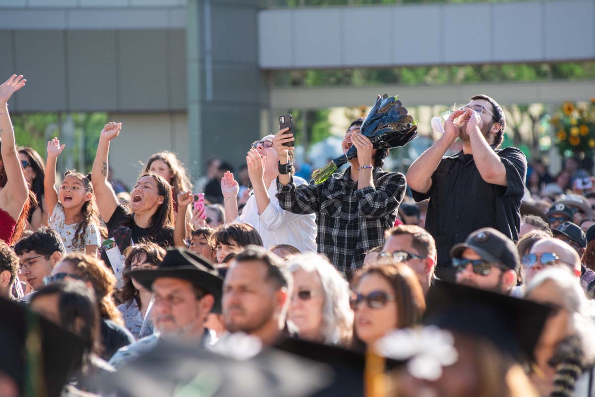 Students receive diploma covers at CHC Commencement 2025.