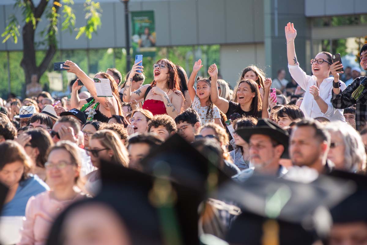 Students receive diploma covers at CHC Commencement 2025.