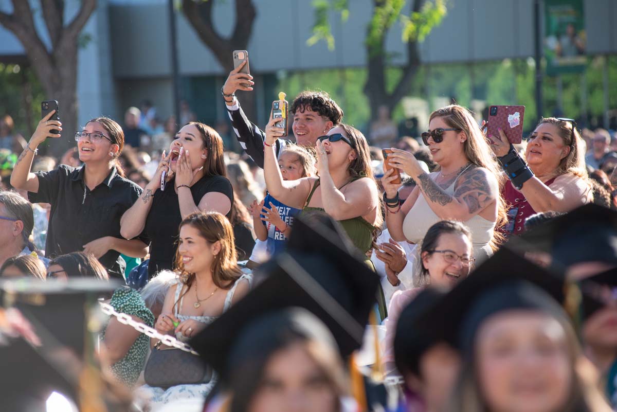 Students receive diploma covers at CHC Commencement 2025.