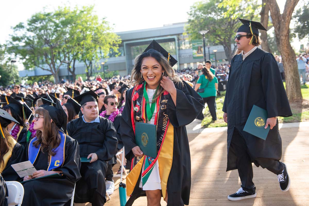 Students receive diploma covers at CHC Commencement 2025.