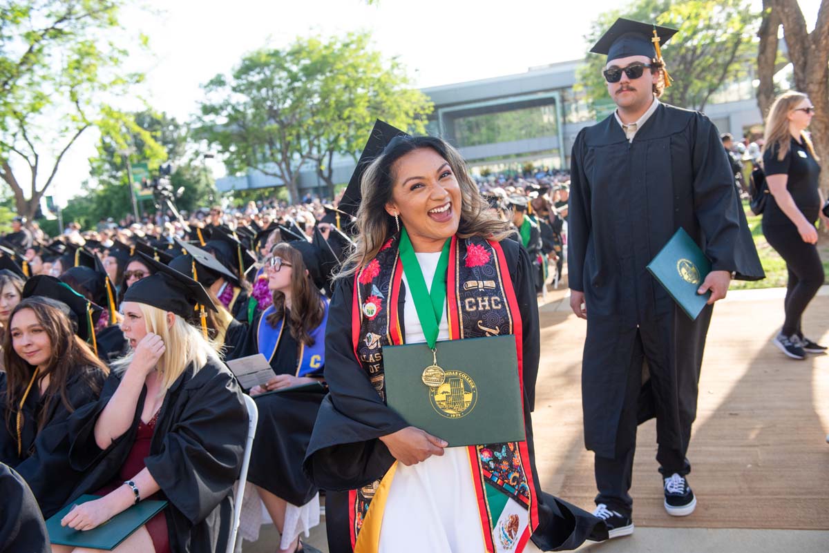 Students receive diploma covers at CHC Commencement 2025.