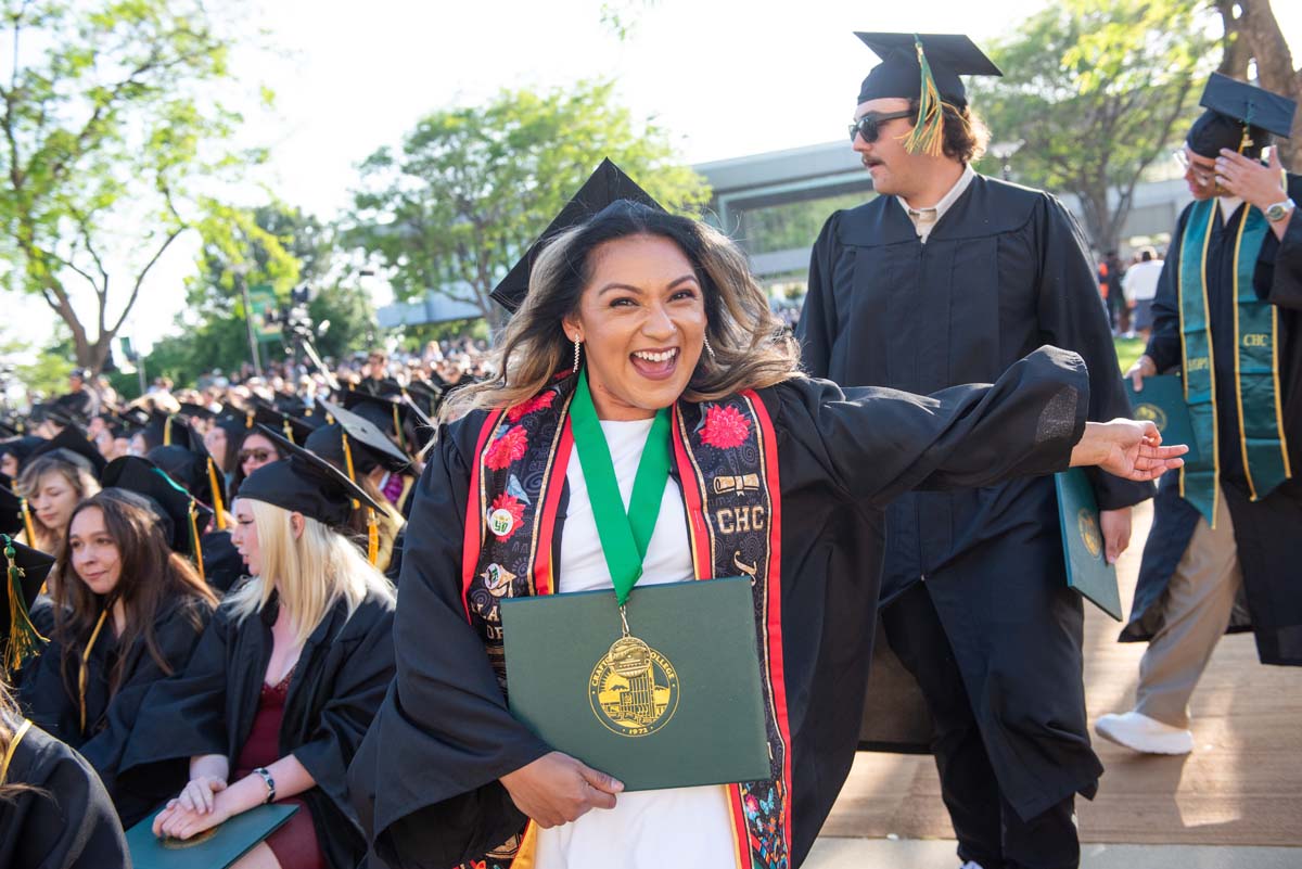 Students receive diploma covers at CHC Commencement 2025.