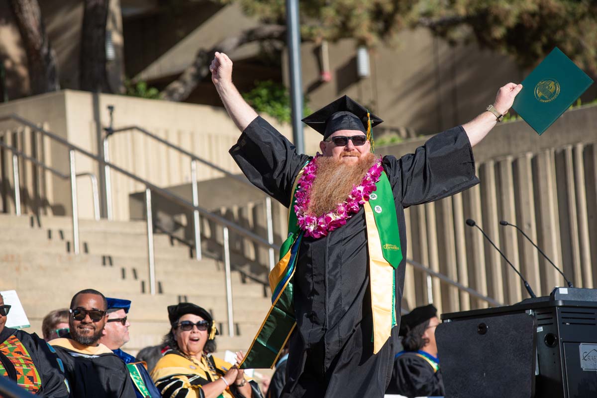 Students receive diploma covers at CHC Commencement 2025.